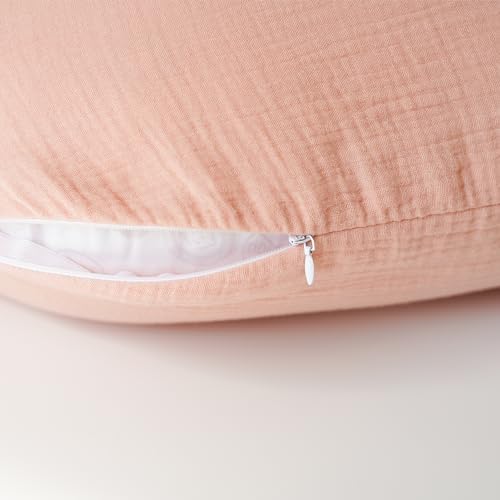Konssy nursing pillow slipcover being placed on a standard feeding pillow