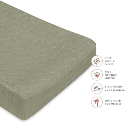 Premium imported organic cotton nursery bedding cover stretched on a changing mattress