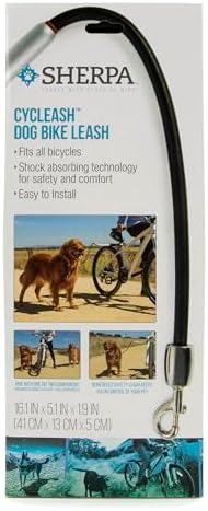 Active dog running beside bicycle using Sherpa Cycleash