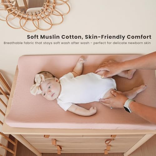 Two pack of Konssy cotton changing table sheets folded neatly