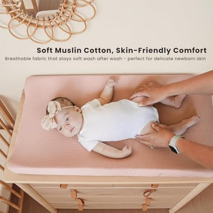 Two pack of Konssy cotton changing table sheets folded neatly