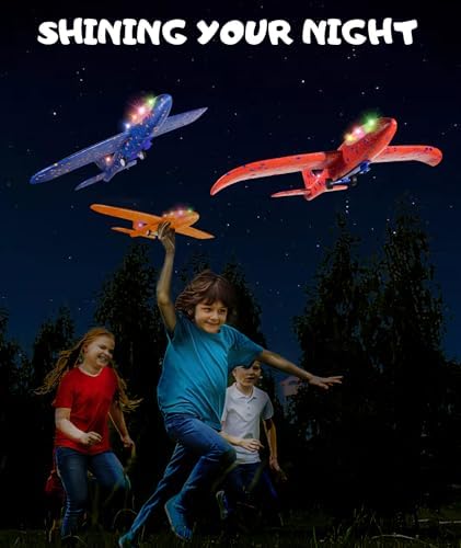 Close up of illuminated LED gliders flying during an evening backyard activity.