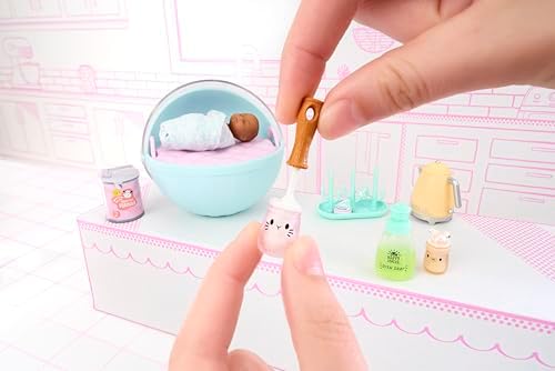 Close up of the detailed miniature diaper caddy and bear tub accessories from the series.