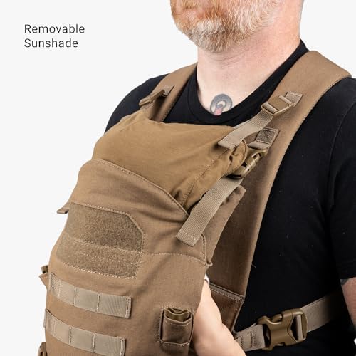 Tactical Baby Gear Coyote Brown infant carrier folded compactly for easy storage inside a travel bag.