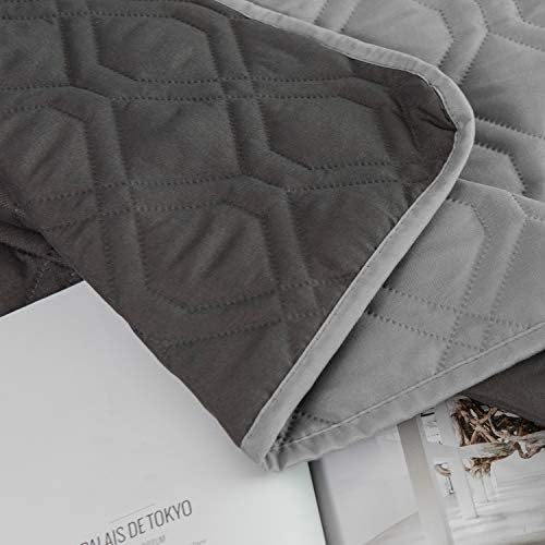 Soft microfiber dog blanket spread over a fabric couch for hair protection