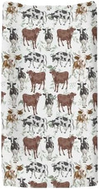 Close up view of watercolor cow and green leaves pattern