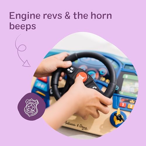 Toddler using the realistic key start and gear shift on the Melissa and Doug dashboard toy