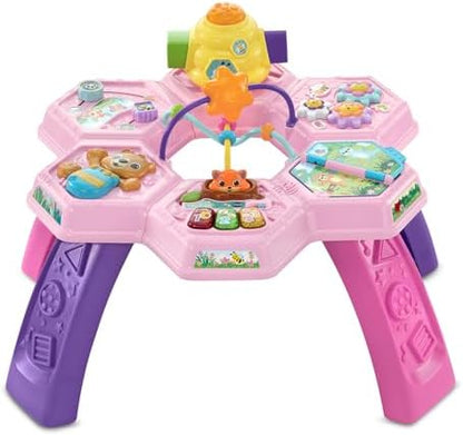 VTech toddler learning table tabletop view highlighting the seven interactive play zones and light-up buttons.