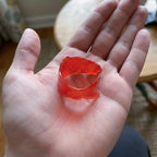 Funny Party Hats fortune telling fish novelty toy reacting inside a person's palm