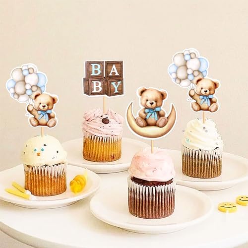 Blue baby shower bear themed cake toppers on cupcakes
