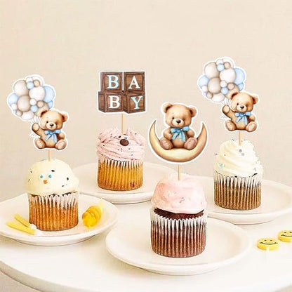 Blue baby shower bear themed cake toppers on cupcakes