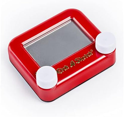 The compact five inch by five inch mechanical pocket travel toy being held to show its portable size for kids.