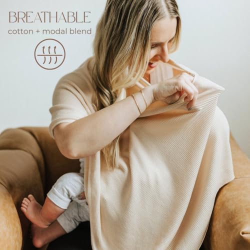 Toci Mom breastfeeding cover used as a protective car seat canopy