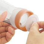 Close up of the secure protective cap on the blue silicone infant feeder