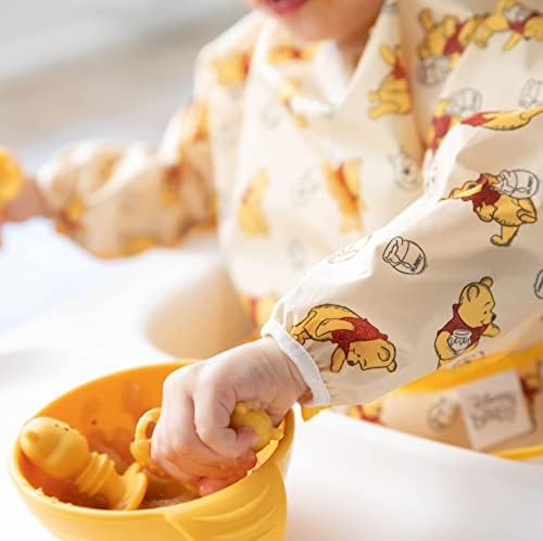 Bumkins long sleeve baby bib close up on the catch all crumb catcher pocket