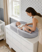 Avocado size cozy diaper changing pad showcasing its contoured safety side walls.