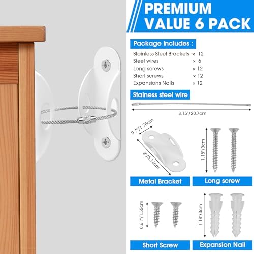 Close up of heavy duty anti tip wall anchors securely fixed to a white dresser for child safety.