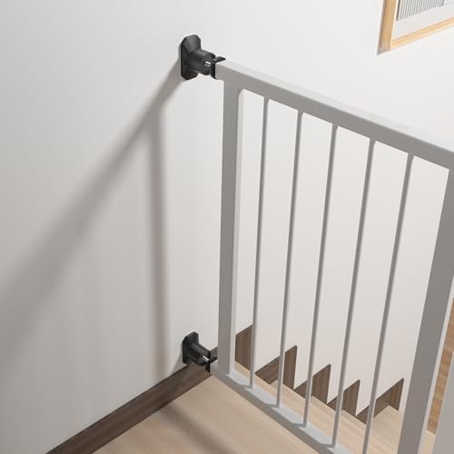Staircase safety gate installation using black rubber wall guards