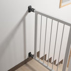 Staircase safety gate installation using black rubber wall guards