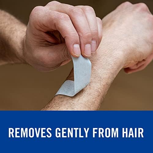 Nexcare pain free removal medical tape applied gently onto a sensitive forearm area.