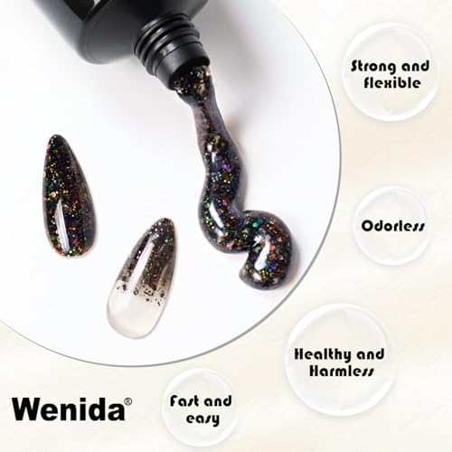 Completed glitter black poly nail extensions on hand