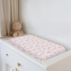 Angle shot of pink Valentine bows baby girl changing pad cover.