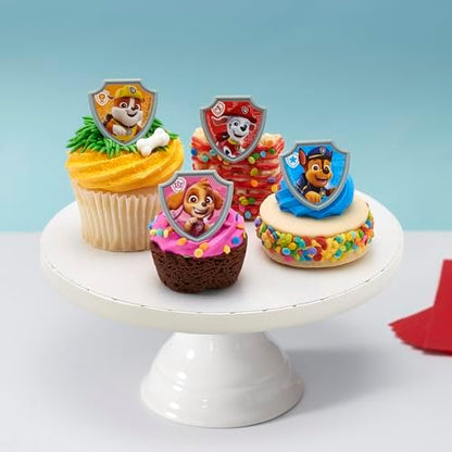 Close up of Paw Patrol shield design cupcake toppers for birthday parties