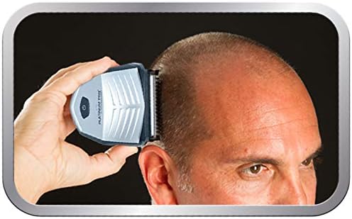 Waterproof hair trimmer being rinsed under running tap water for easy cleaning