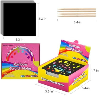 Black coated scratch-off note sheets revealing bright rainbow colors underneath with wooden stylus