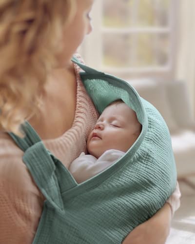 Mother using Blissful Diary muslin nursing cover in public