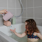Mushie baby bath safety accessory in premium silicone packaging