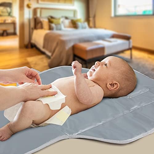 Phoebus Baby changing mat placed inside a diaper backpack