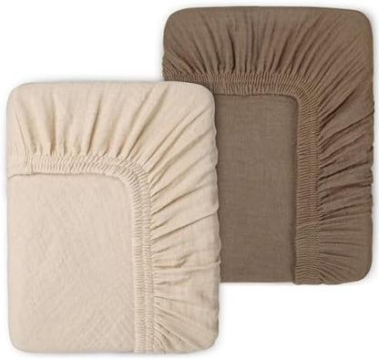 Two pack baby changing table sheets in neutral taupe brown and light beige colors.