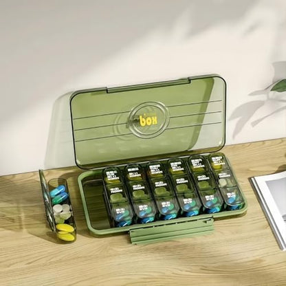 Open medicine organizer showing removable tray and internal compartments