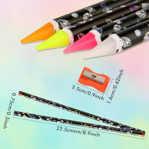 Close up of the self adhesive wax tip of the diamond art pencil picking up a tiny crystal gem.