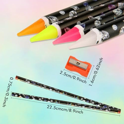 Close up of the self adhesive wax tip of the diamond art pencil picking up a tiny crystal gem.