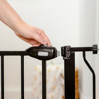 All steel chew proof dog gate installed at bottom of staircase