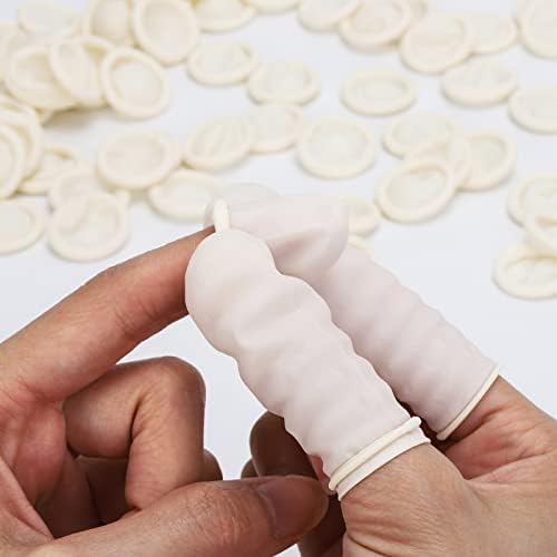 Large size waterproof disposable finger covers spread out on flat surface
