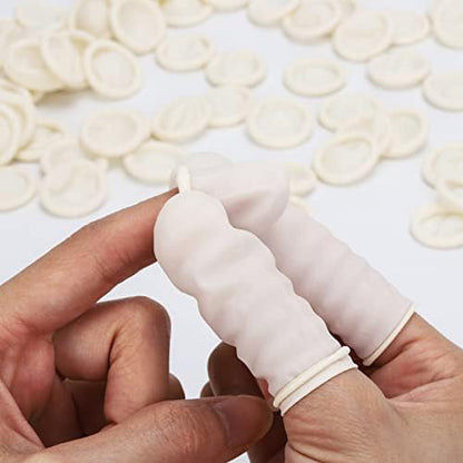 Large size waterproof disposable finger covers spread out on flat surface