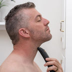 OLOV For Man electric razor on USB charging dock