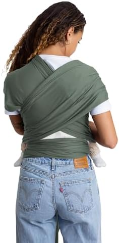 Adjustable infant sling carrier showing the ergonomic weight distribution design.