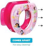 Disassembled parts of the Disney Princess potty trainer showing the easy cleaning mechanism
