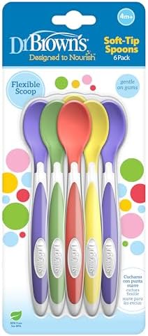 Dr. Brown's long handle toddler spoons reaching into a deep glass baby food jar