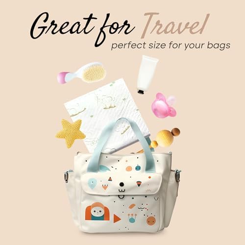 Folded portable changing pad next to a diaper bag