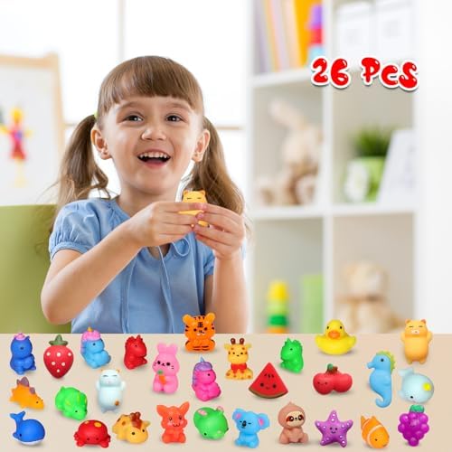A collection of colorful miniature animal squishies laid out as birthday party favor goodie bag fillers.