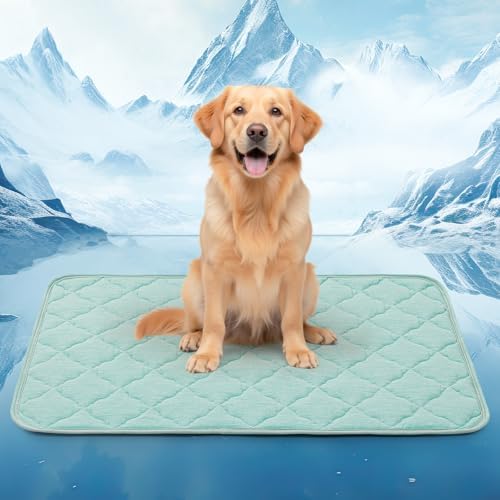 Extra large pet cooling pad placed inside a metal dog crate for summer comfort.