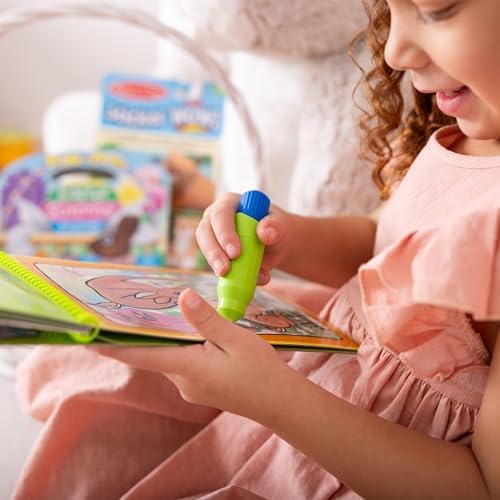 Open pages of the water reveal activity book showcasing the interactive search and find spring illustrations.