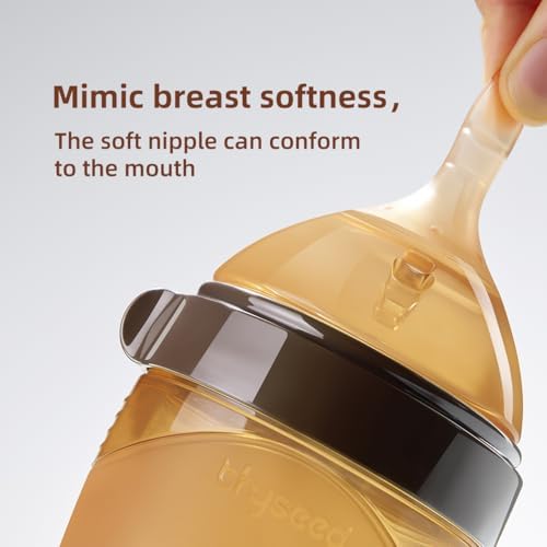 BPA-free food-grade liquid silicone baby bottle nipple being flexed to demonstrate soft texture.