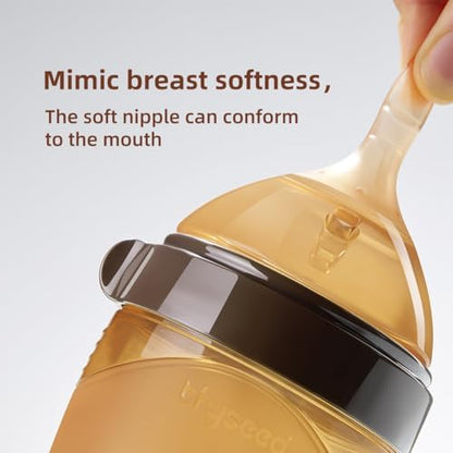 BPA-free food-grade liquid silicone baby bottle nipple being flexed to demonstrate soft texture.