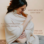 Mother using Toci Mom nursing poncho for discreet public breastfeeding